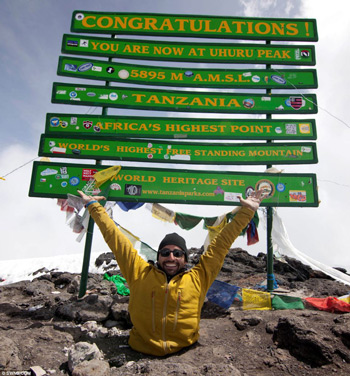 Spencer West atop Mt. Kilimanjaro