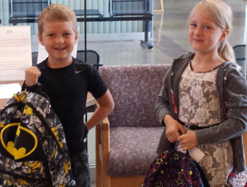 Clark's little penguins enjoy new backpacks filled with school supplies. Donations were made possible by Clark employees. One parent said, "I’m currently homeless, so this helps so much.”