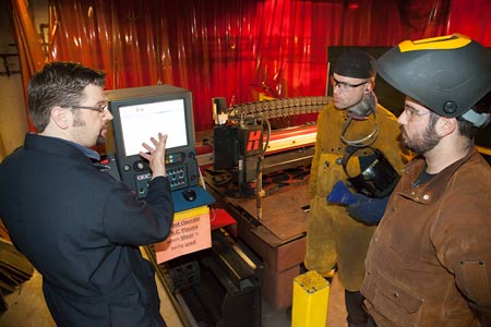 Welding Students observe a CNC plasma table
