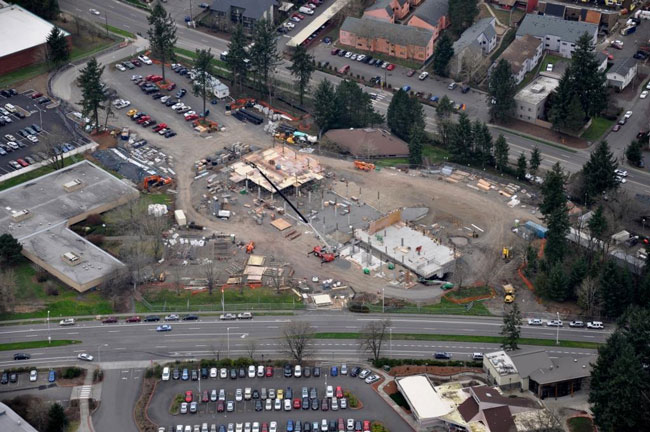 This February 18 photo is facing north, northwest with Fourth Plain Bld across the top. Fort Vancouver Way runs across the bottom and Clark's T building is at the left. The foundation building is just north of the building site. Photo by Skanska Corp.