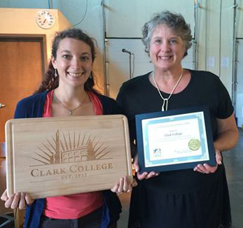 Sarah Weinberger, Edie Blakley accept an award