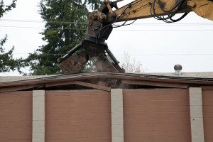 The retail buildings on the corner of 4th Plain Blvd. and Fort Vancouver Way being torn down. Demolition started Monday, March 30, 2015.