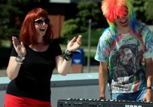Library Dean Michelle Bagley rocks out with VP of Instruction Tim Cook during a student appreciation event on campus.