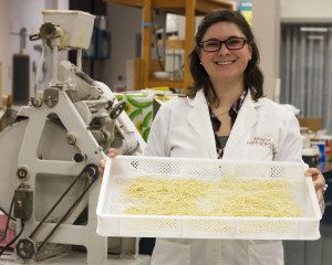 Jessica Murray ’12 holds pasta made from a one-of-a-kind flour. Photo by Seth Truscott, WSU CAHNRS.