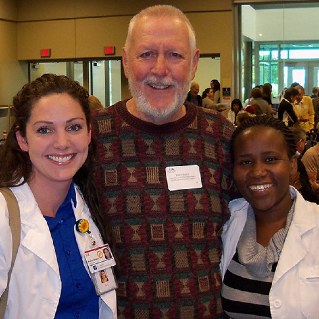 Donor Jerry Smith with Tia Clary (left) and Stellah Nyamongo (right), the Nursing students his scholarship supports.