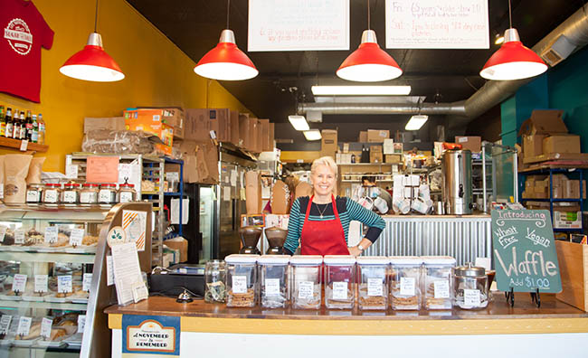 Tierre Benton ’11 at the front counter of her downtown Vancouver business, Sugar and Salt Bakery, Café and Catering. 
