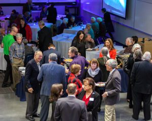 Guests mingle at the foundation's holiday party.