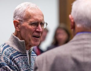 Larry Swatosh '57 enjoying a conversation during the foundation's holiday party.