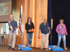 Four Clark College Faculty and Staff members playing Cornhole toss