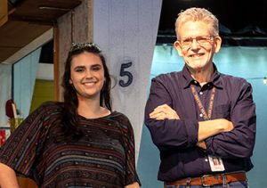 Clark student Priya Oetmann, left, stands with Mark Owsley ’79, center, Clark’s stage manager for 35 years.